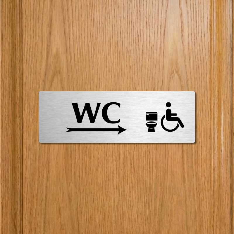 WC invalida vpravo, 240x79mm, stříbrná popiska s ozdobou uprostřed